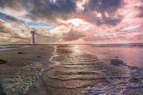 evening photo of the lighthouse on the coast