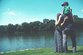 people lake green grass