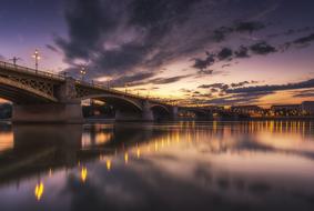 Beautiful landscape with the bridge, with the lights, at colorful and beautiful dawn