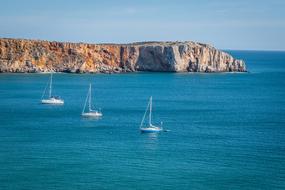 boat on the sea near the rocks