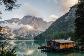 Banana Trees and Clouds on the beautiful Fjord with a hut on the landscape