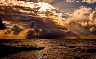 gorgeous sunset sky over dark water, baltic sea