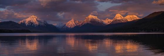 Beautiful and colorful landscape of the Lake McDonald, among the mountains, in the Glacier National Park, Montana, USA, at colorful and beautiful dusk