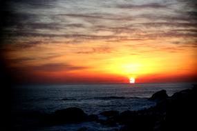 Sea Sunrise red on the horizon above the water