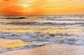 orange clouds over the coast of denmark