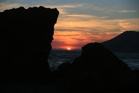 Sunset over Sea, view from rocky coast