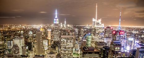 Cityscape of Manhattan, New York, USA, with the colorful lights, in the evening