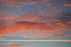 Beautiful blue sky with colorful sunset in the clouds, in the evening