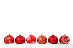Beautiful and colorful, shiny Christmas ball decorations on the snow