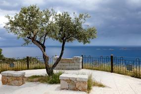 Beautiful and colorful South East Coast of Sardinia, Italy, with the plants, under the clouds