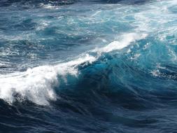 Beautiful, white waves in the sea with turquoise and blue water