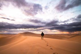 Man Alone sand sky