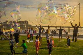 children's party with soap bubbles in the evening