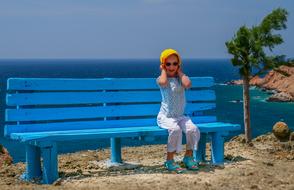 girl on bench on Sea Beach