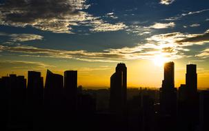 yellow sunset over skyscraper silhouettes