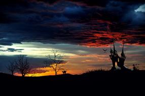 silhouette of a haunted castle in a mystical landscape