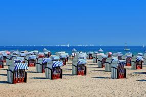 striped tents on the beach near the baltic sea