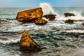 stones on the beach with waves