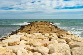 pier with stones near the sea in spain