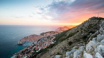 Beautiful and colorful Dubrovnik, on the view from the hill, in Croatia, at colorful sunset