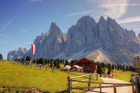 Beautiful and colorful landscape of the Funes, Dolomites with plants and hut in Italy