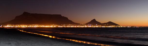 night lights near mountains at dusk