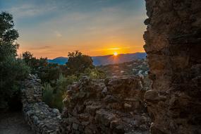 Beautiful castle walls against the background of a colorful, romantic sunset