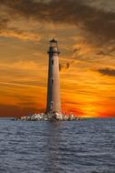 Beautiful Dauphin Island with lighthouse at colorful sunset