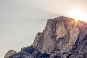 Bright sun over the rock