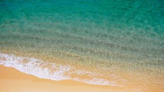 Beautiful, sandy beach with the beautiful turquoise water of different shades