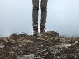 feet in hiking boots in nature
