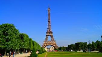 Green lawn in front of the Eiffel Tower