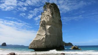 cliffs on the coast of new zealand on a sunny day