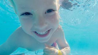 baby swims underwater