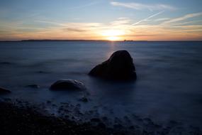 Stones in the sea at dusk in Kalundborg