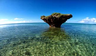 rock formation in clear water in japan