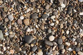 Top view of the beautiful and colorful gravel stones on the beach