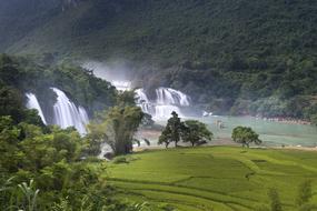 waterfall near the green mountain in vietnam