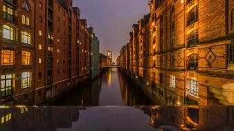 Hamburg architecture is reflected in the canal waters at night