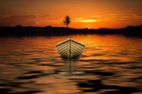 White boat on water in orange twilight