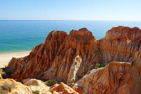 red mountains by the sea in Portugal