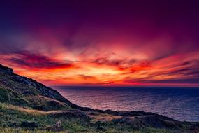 Beautiful landscape with the green shore, at colorful, gradient sunset in Italy
