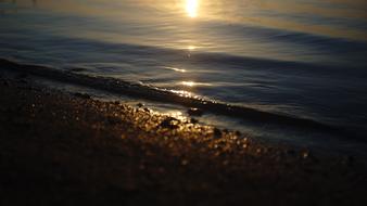 sea waves on the beach during sunset
