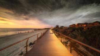 boardwalk on australia beach at dusk