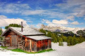 barn in the dolomites in the snow