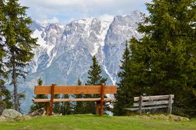 two wooden benches at scenic alpine landscape, austria