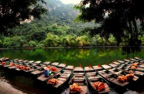 boats with life jackets on the river in the jungle in Vietnam