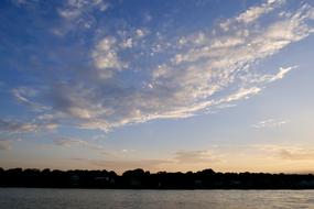 Beautiful landscape with Elbe, among the trees, in Hamburg, Germany, at colorful and beautiful dawn