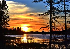 Beautiful landscape of the water, among the plants, in Quebec, Canada, at colorful and beautiful sunset
