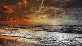 sun rays, sea waves on the coast